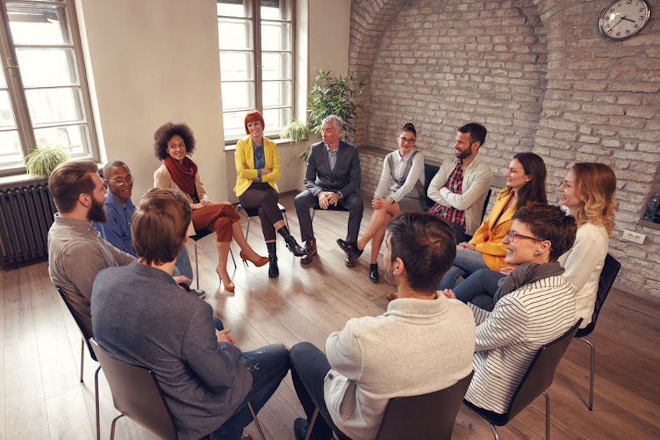 Group therapy session explaining the four types of therapy available in a Spokane, WA drug rehab center