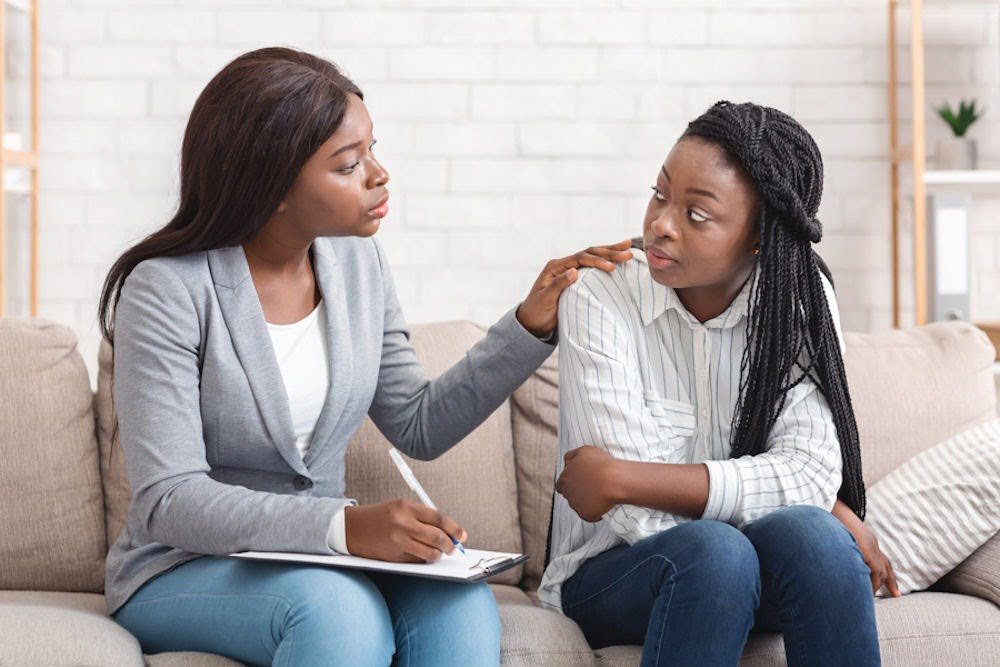 Counselor explaining drug and alcohol treatment levels