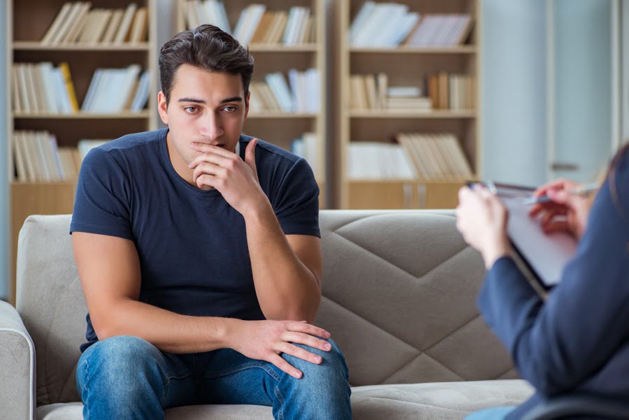 Man talking with a therapist during hydrocodone withdrawal treatment session