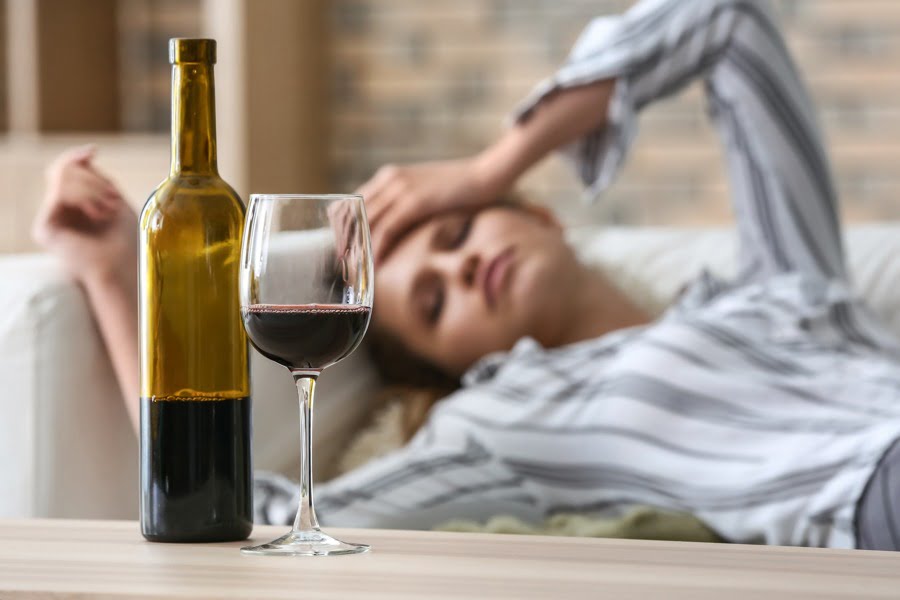A woman struggling with alcohol addiction