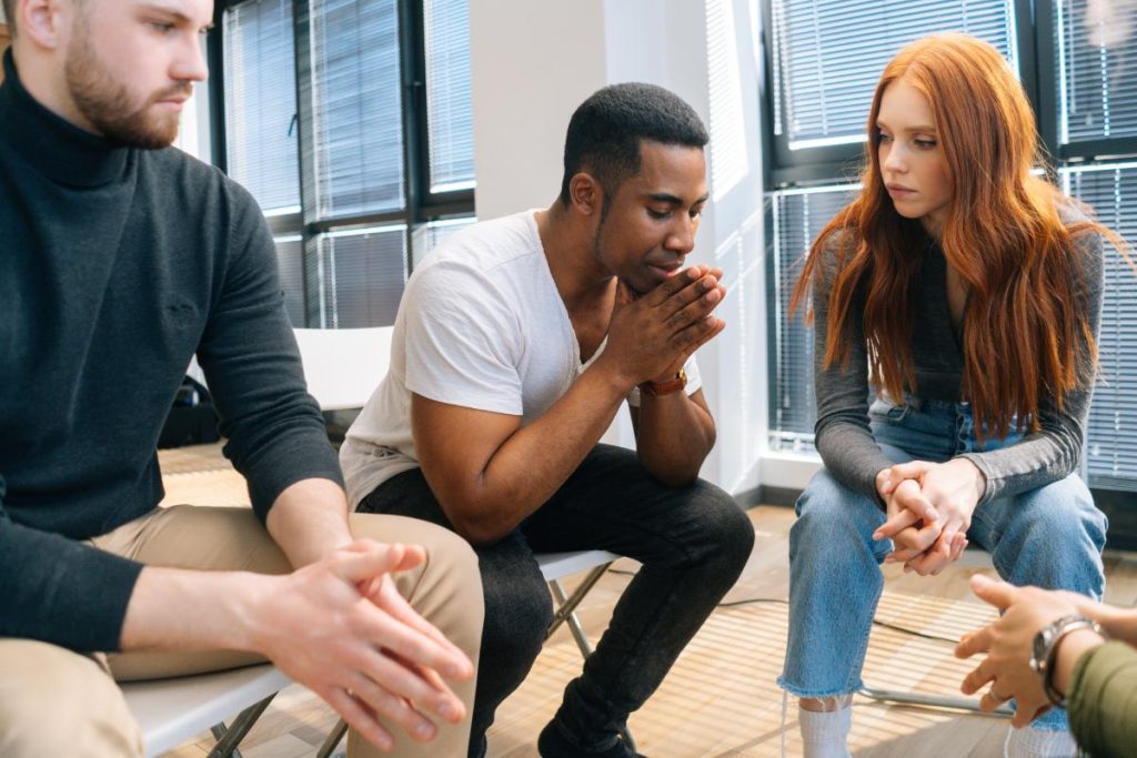 Person practicing anger management techniques to improve well-being