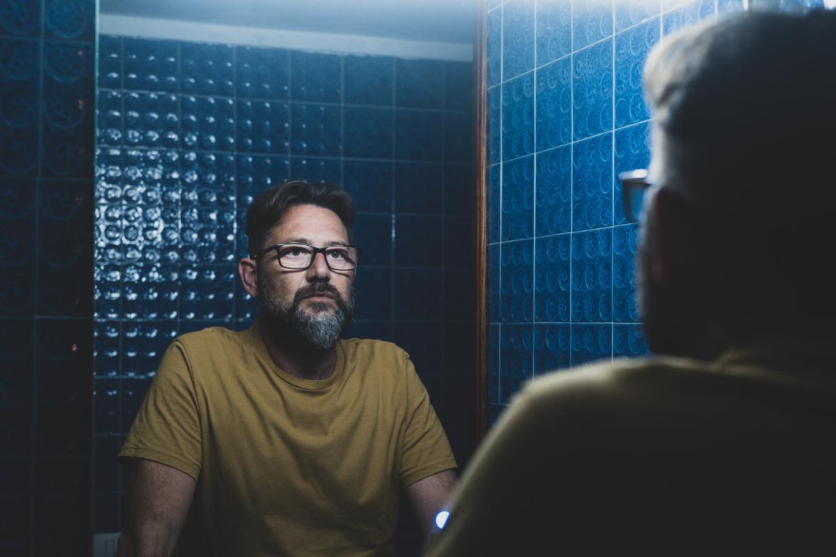 Man contemplating, What is dissociative identity disorder?