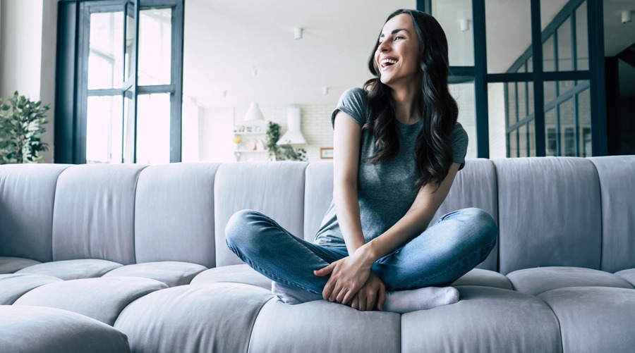 A woman watching movies that inspire and heal as part of her addiction recovery