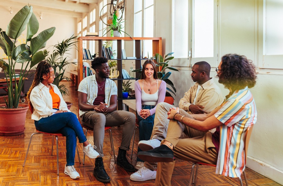 Support group discussing coping skills for the stages of relapse