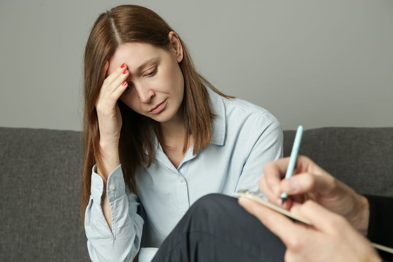 woman experiencing headache from ecstasy use