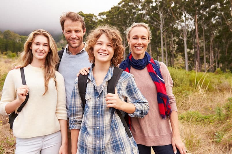 Family enjoying a sober travel adventure together
