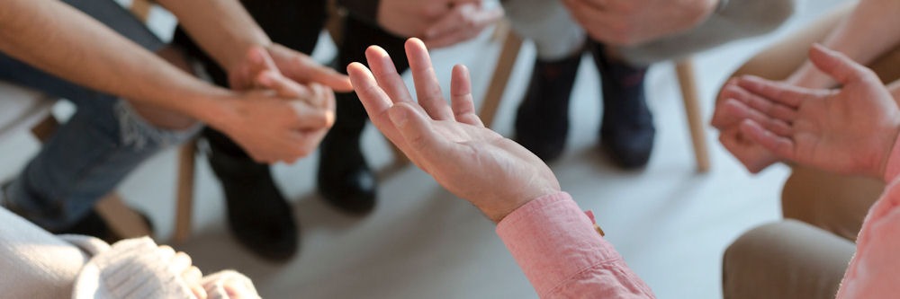 close-up of an individual’s hands during Fentanyl group therapy