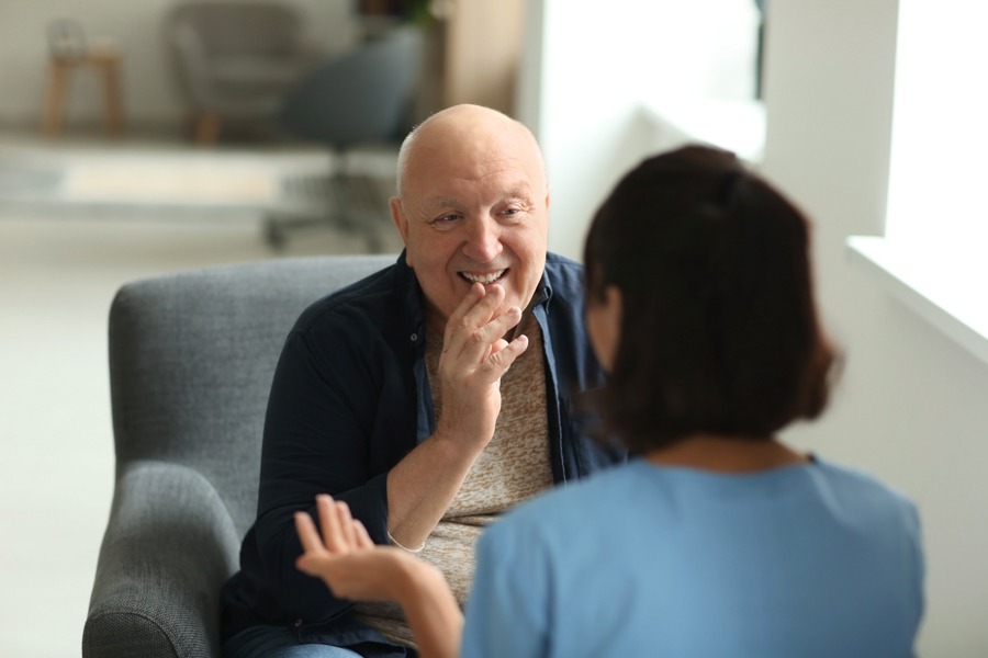 Man discussing meth face recovery and treatment with his therapist
