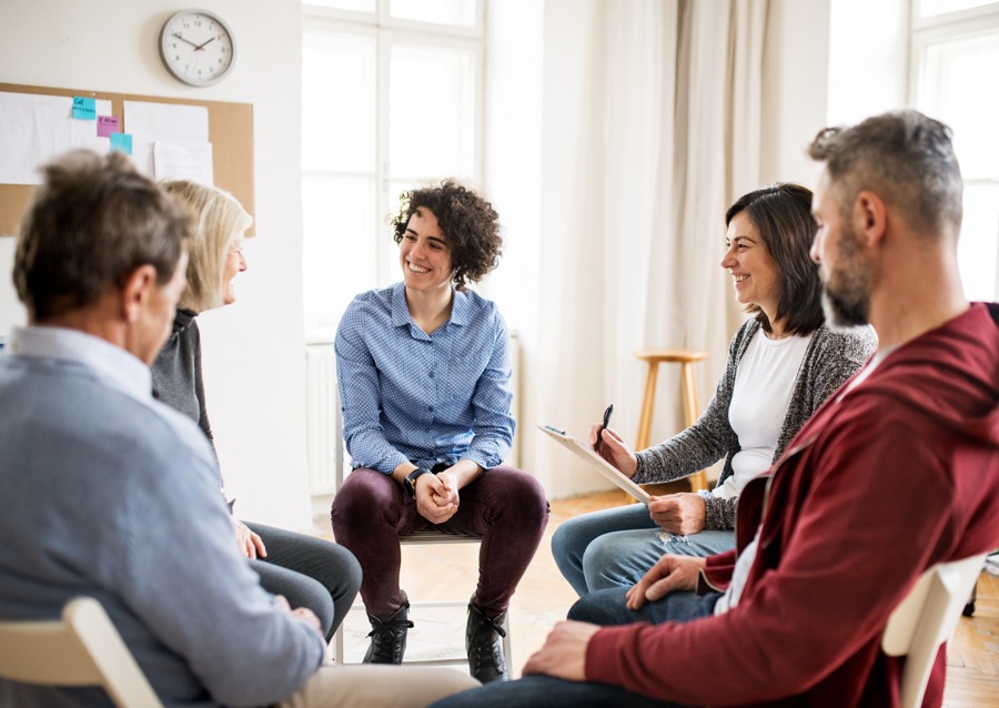 counselor speaking to a small group of adults about cocaine withdrawal