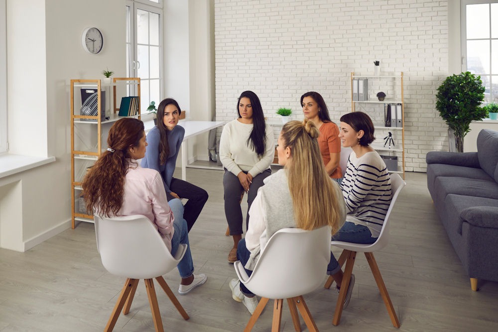 Young adults discussing crack vs meth differences in group therapy