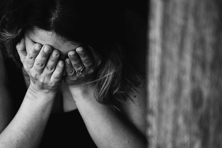 close-up of person experiencing headaches from whippits use