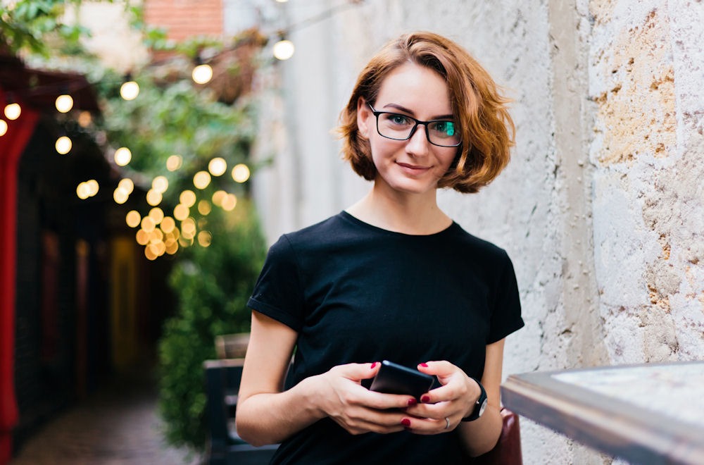 Joyful woman embracing sobriety with non-alcoholic drink