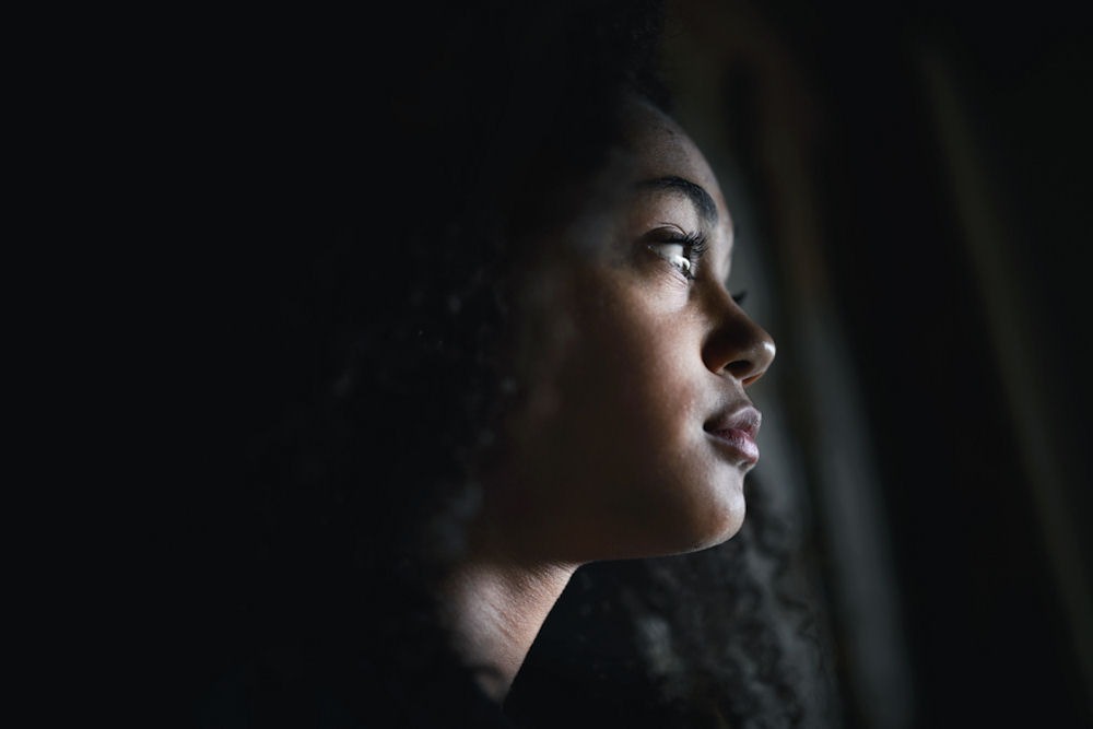 Woman reflecting while experiencing ongoing antidepressant symptoms