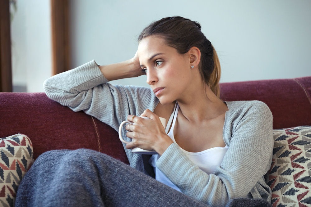 a woman sitting on a chair, worried about her cocaine use