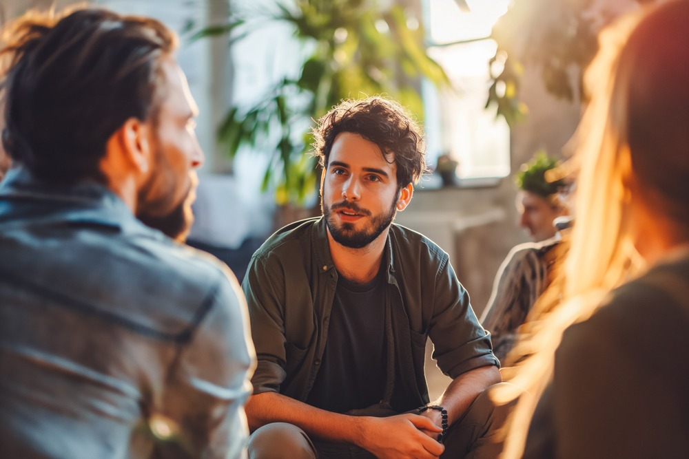 Counselor helping a patient understand dual diagnosis examples and treatment options
