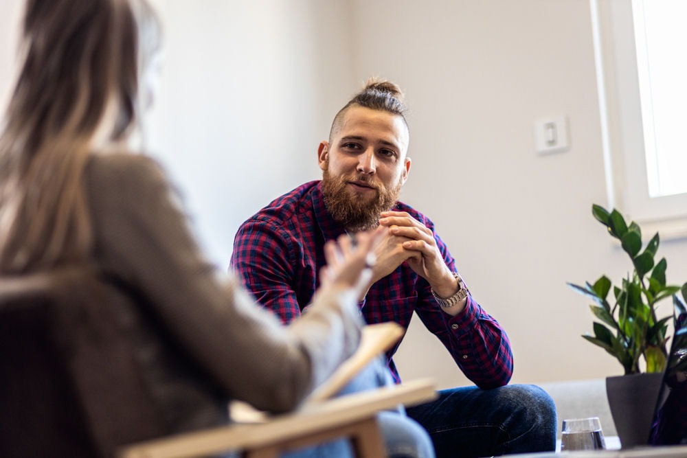 man in therapy asking what does crack smell like during recovery
