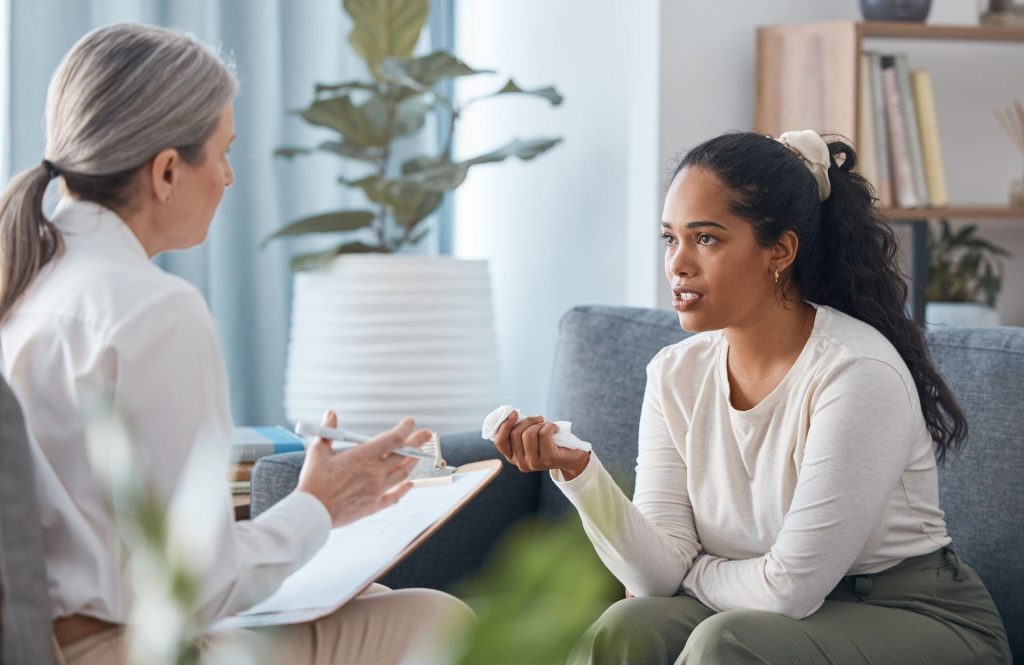 a woman with postpartum depression in therapy