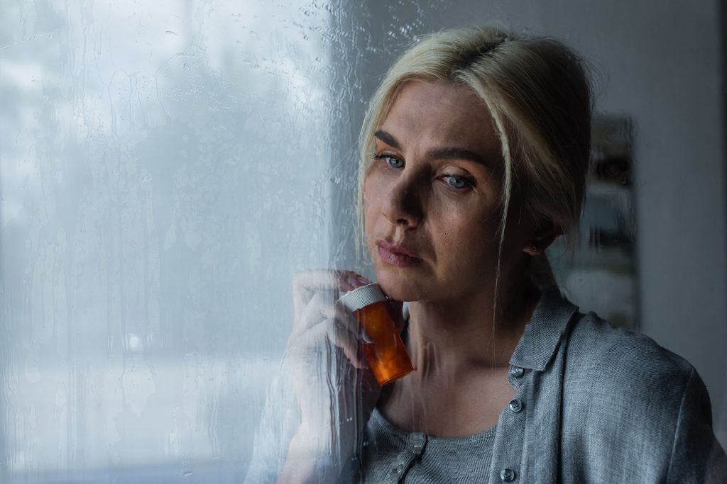 woman holding buspirone asking about the top 10 medications for anxiety.