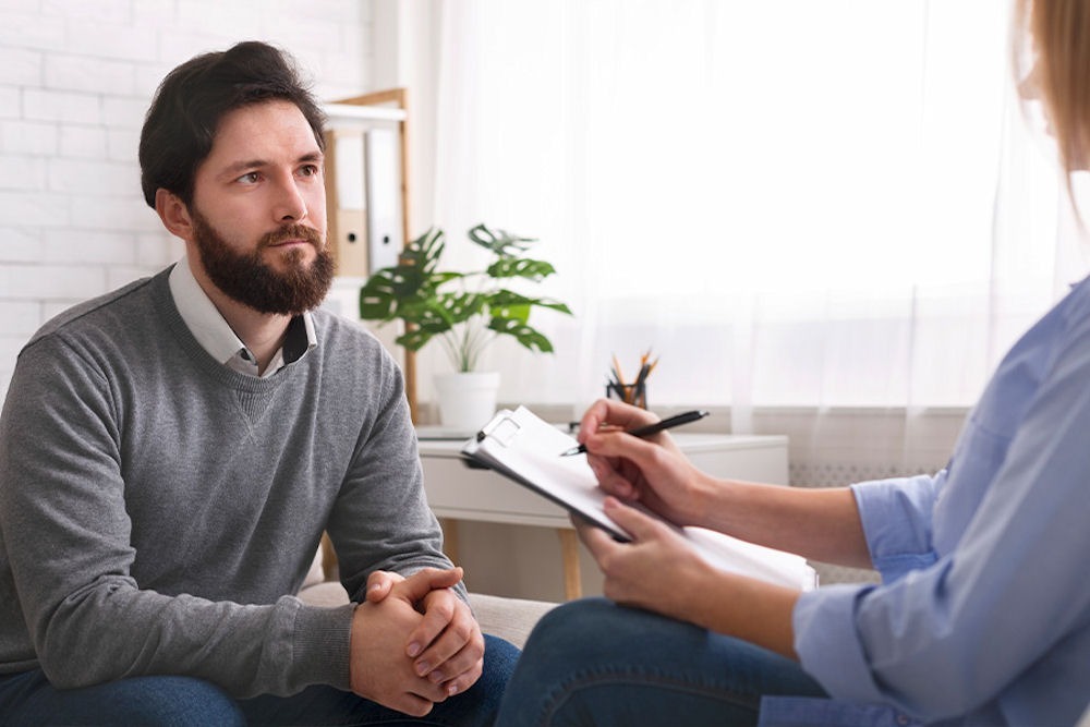 heroin-withdrawal Man in a counseling session talking about heroin withdrawal