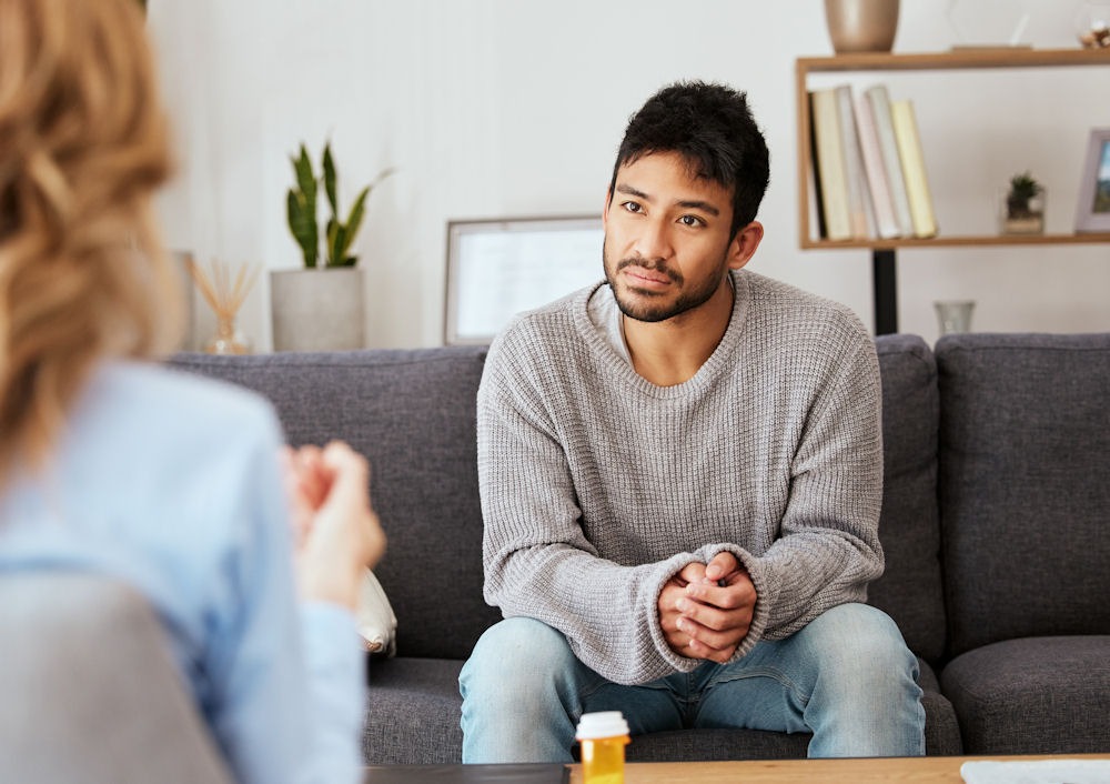 marijuana-withdrawal-process Man discussing progress during marijuana withdrawal timeline with therapist