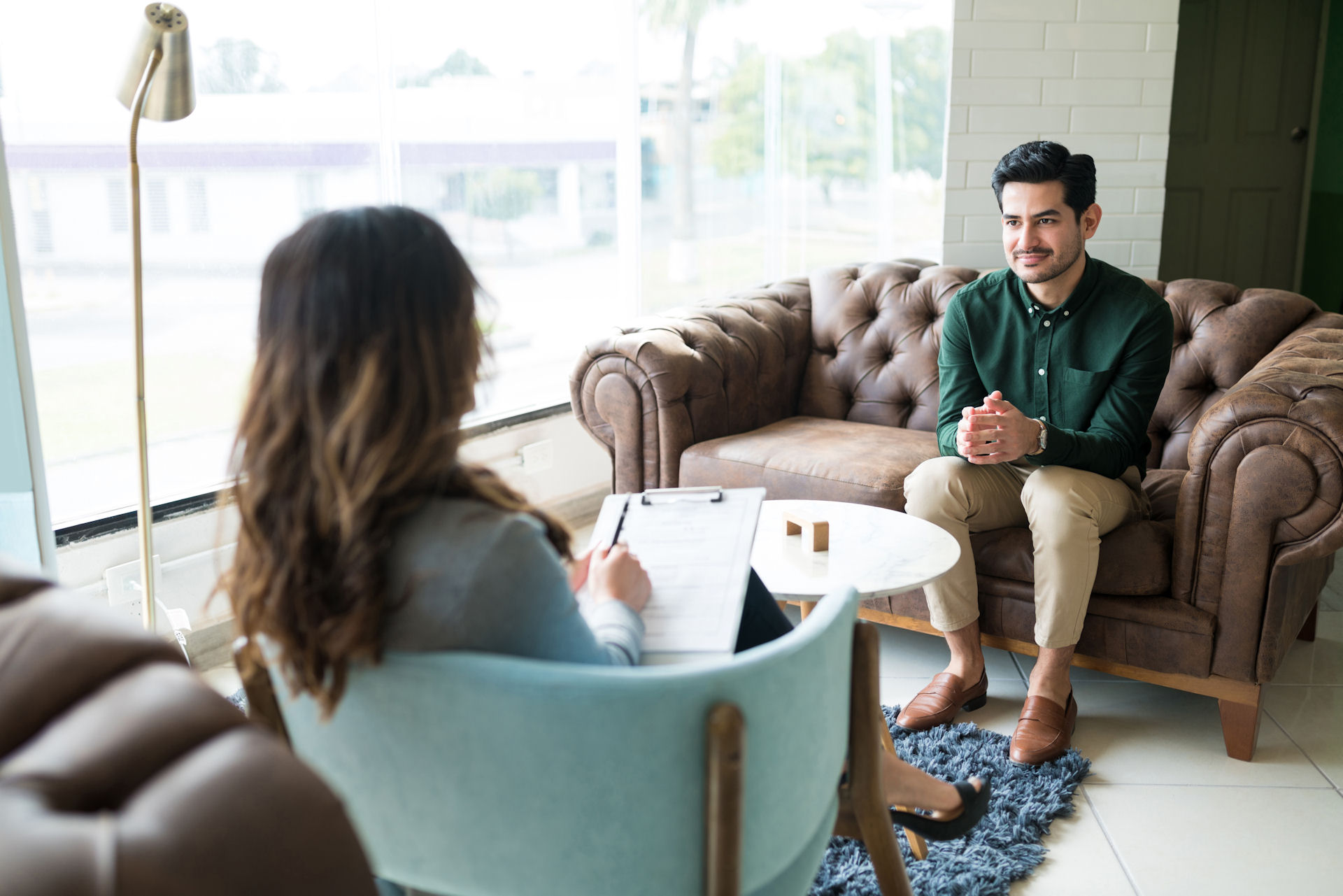 Counselor explaining the anxiety programs to a patient