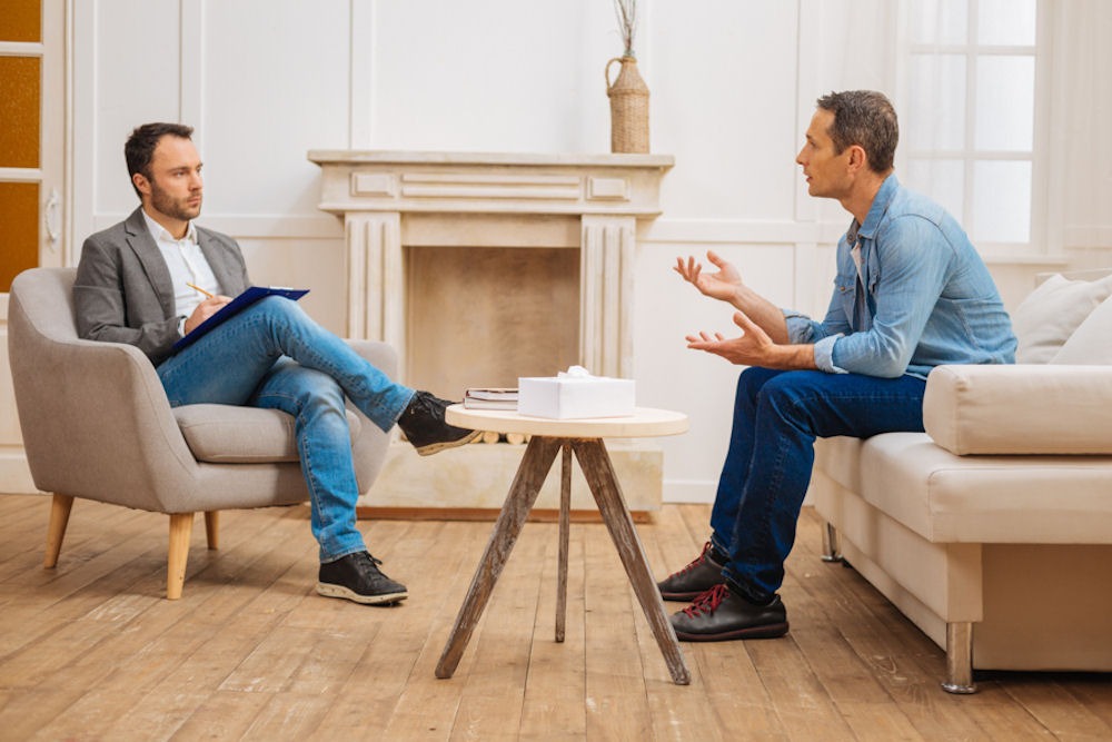 man in therapy for mental health with First Choice Health Insurance Program