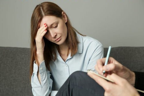 Mental health professional assisting patient with psychiatric care