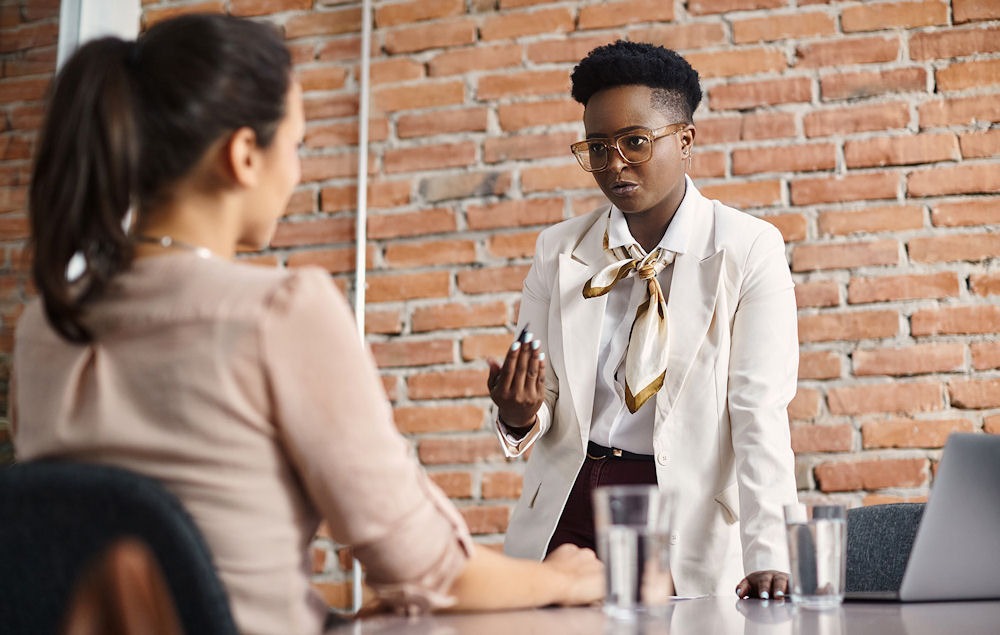 a boss speaking to employee