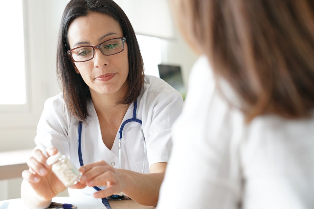 a doctor showing medication instructions