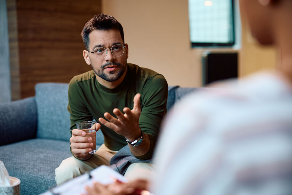 a-man-speaking-therapist-in-therapy