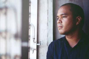 a man staring at window