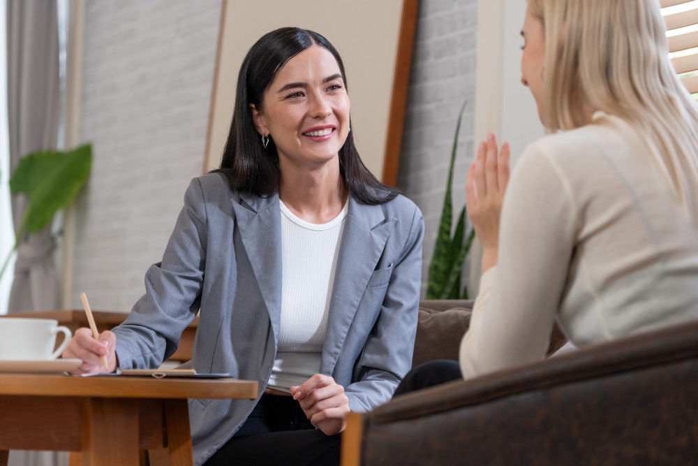 a therapist smiling at patient
