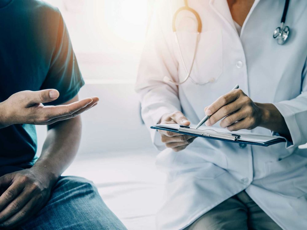 A patient is asking some questions to his doctor at a rehab in Medford, Oregon A patient is asking some questions to his doctor at a rehab in Medford, Oregon