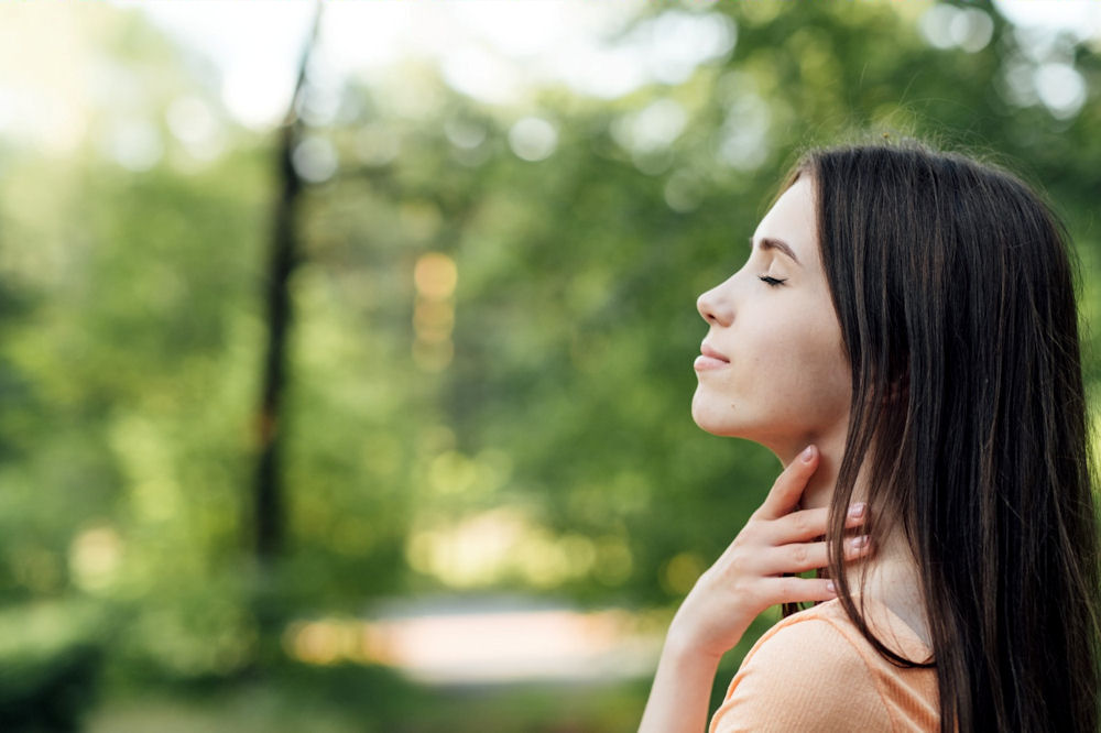 a woman with her eyes closed meditating