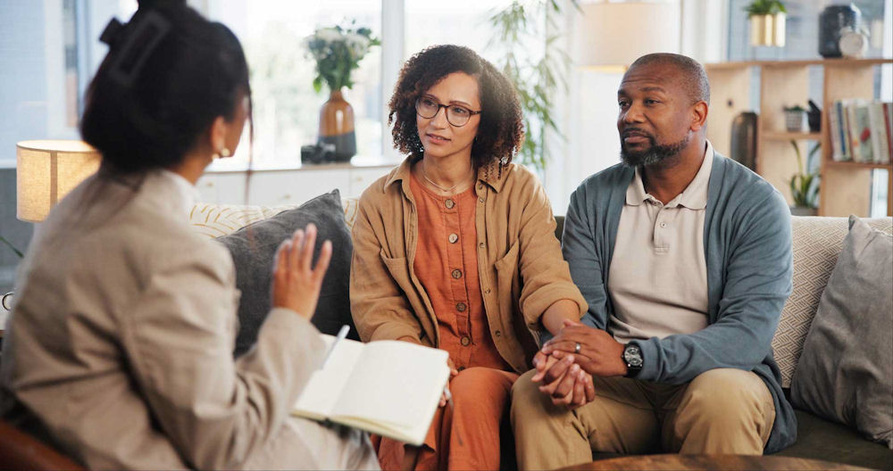 couple-holding-hands-in-therapy