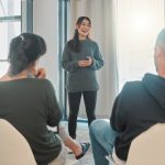 a-woman-smiling-in-therapy-session